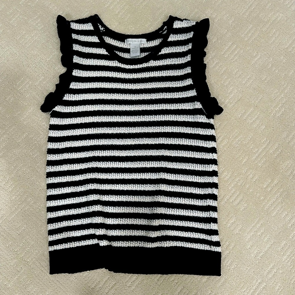 Design History-M-black and cream stripe sleeveless sweater with ruffle detail.